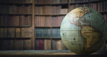 A globe on the desk of an international business professional